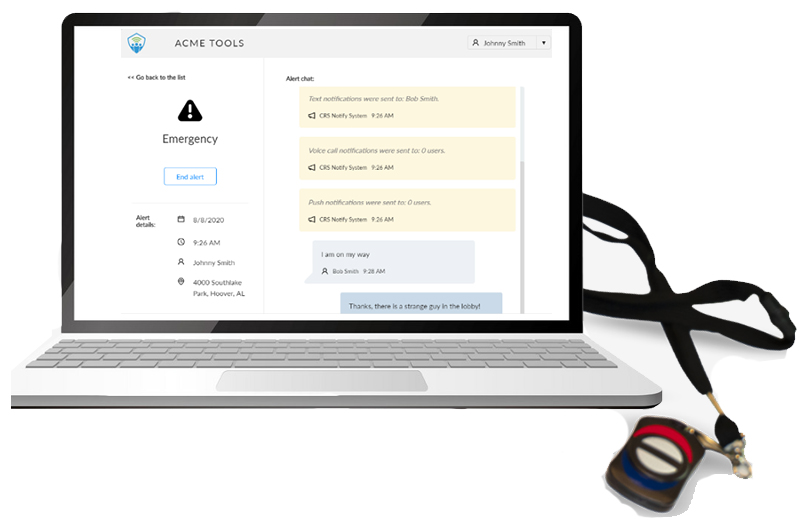 Laptop open with TeamAlert application on the screen. Wireless panic button on a lanyard is pictued beside laptop