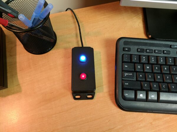 image of a wired panic button on a desk