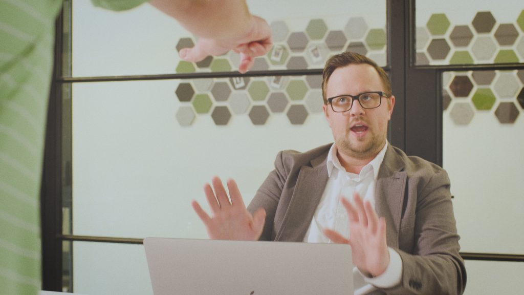 Man being confronted by another man