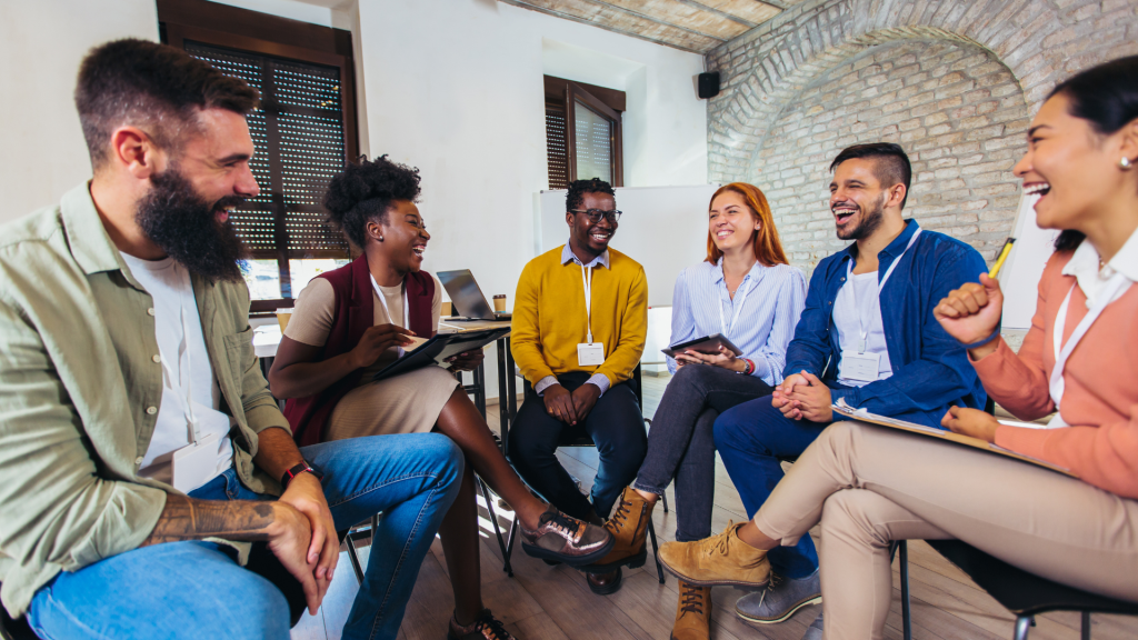 Team working together, chatting, and enjoying a positive environment 