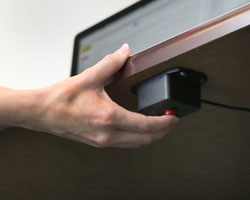 Pressing a panic button under the desk